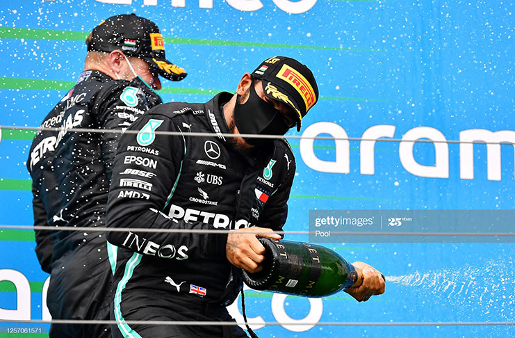 Race winner Lewis Hamilton of Great Britain and Mercedes GP celebrates on the podium after the Formula One Grand Prix of Hungary at Hungaroring on July 19, 2020 in Budapest, Hungary. (Photo by Joe Klamar/Pool via Getty Images)