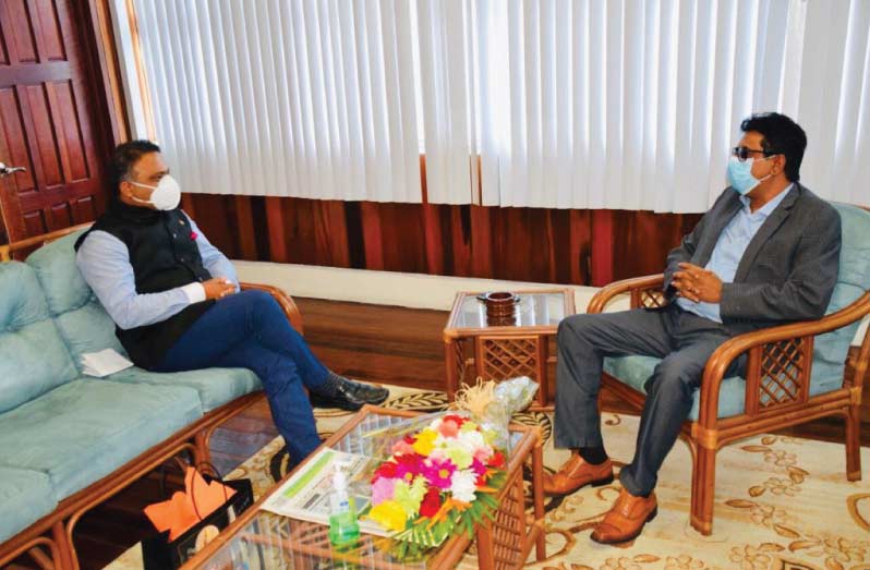 Attorney General Mohabir Anil Nandlall in discussion with Indian High Commissioner, Dr. K. J. Srinivasa.