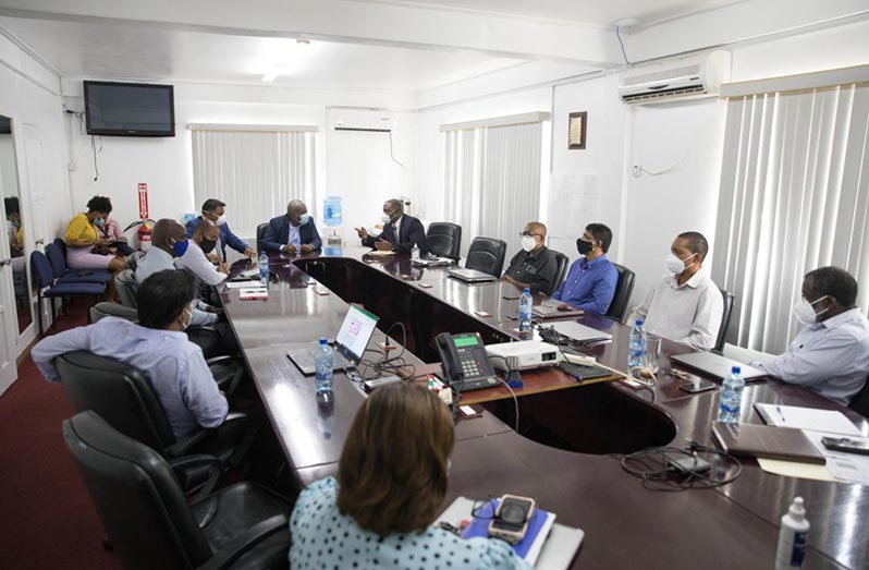 Prime Minister, Brig. (ret’d), Mark Phillips and Minister within the Ministry of Public Works, Deodat Indar, during the meeting with the senior management of GPL (DPI photo)
