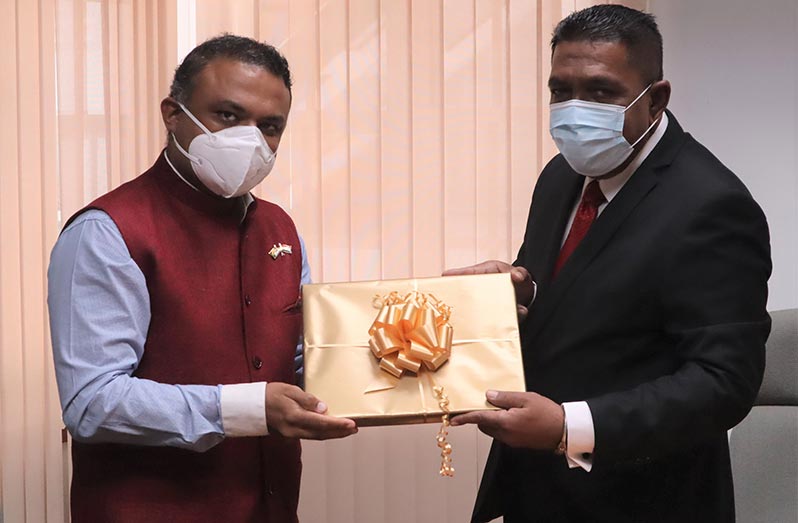 Agriculture Minister, Zulfikar Mustapha, receives a token of appreciation from India’s High Commissioner to Guyana, Dr. K. J. Srinivasa