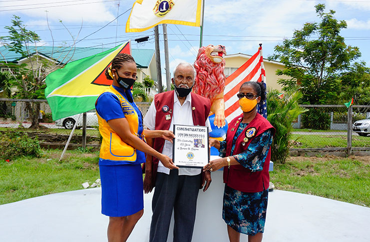Savouring the moment with Past District Governor 3-Star, Lion SMV Nasser (centre), are President Shondelle Gray, (left) and District Governor Denise Bentinck