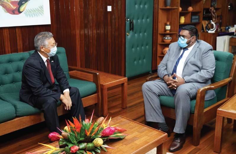 President, Dr. Mohamed Irfaan Ali in discussion with Ambassador of the People’s Republic of China to the Cooperative Republic of Guyana, Cui Jianchun (DPI photo)