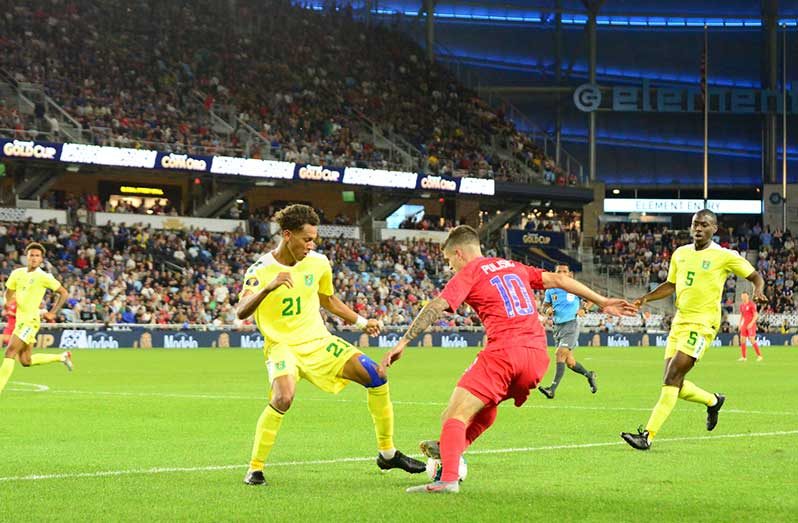 FLASH BACK!USA's Christian Pulisic (#10), about to make a move on Guyana's Brandon Beresford during his side's 4-0 win at the Allianz Stadium in Minnesota during the 2019 CONCACAF Gold Cup. (Samuel Maughn photo)
