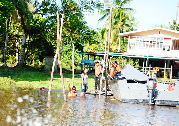 Residents having a cool bath in the Bonasika Creek (Carl Croker photos)