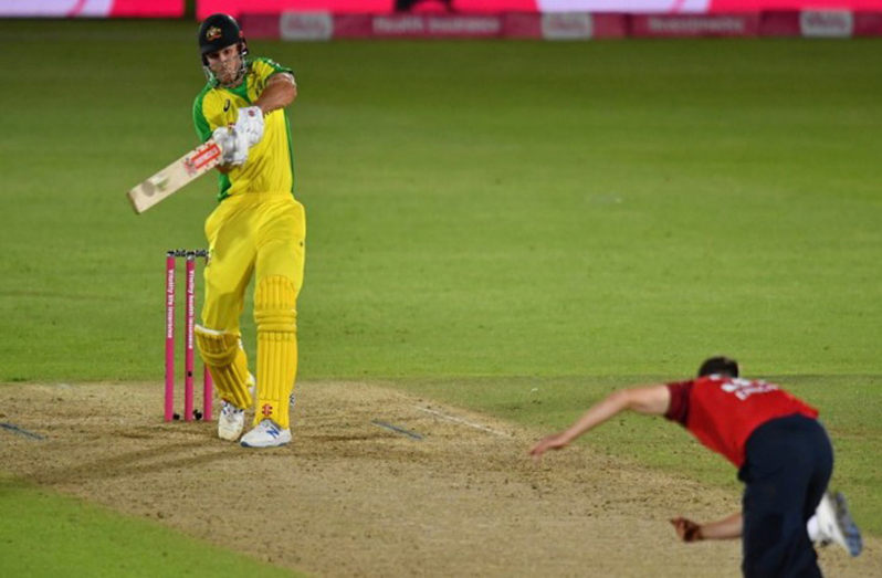 Australian batsman Mitchell Marsh (L) hits the ball for six during their Twenty20 international match against England at the Ageas Bowl in Southampton on Tuesday.—( AFP photo)