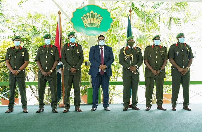 At Monday’s ceremony to officially recognise the five GDF Officers who were recently promoted. With President Irfaan Ali and Chief-of-Staff Godfrey Bess (centre and third right respectively) are the five Servicemen in whose honour the event was held