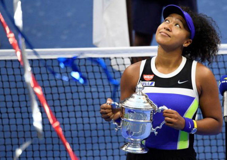 Naomi Osaka celebrates with the championship trophy after her match against Victoria Azarenka of Belarus (not pictured) in the women's singles final on day 13 of the 2020 U.S. Open at USTA Billie Jean King National Tennis Center, Flushing Meadows, New York, USA.  (Mandatory Credit: Danielle Parhizkaran-USA TODAY Sports/File Photo)