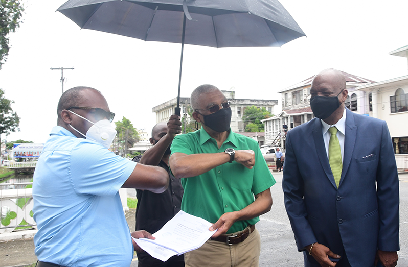 From left: Attorney Roysdale Forde, former President, David Granger and Joseph Harmon after filing the elections petition (Adrian Narine photo)