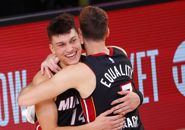 Tyler Herro gets a hug from Goran Dragic after Game 4 of the Eastern Conference Finals at AdventHealth Arena at the ESPN Wide World Of Sports Complex on September 23, 2020 in Lake Buena Vista, Florida. (Kevin C. Cox/Getty Images)