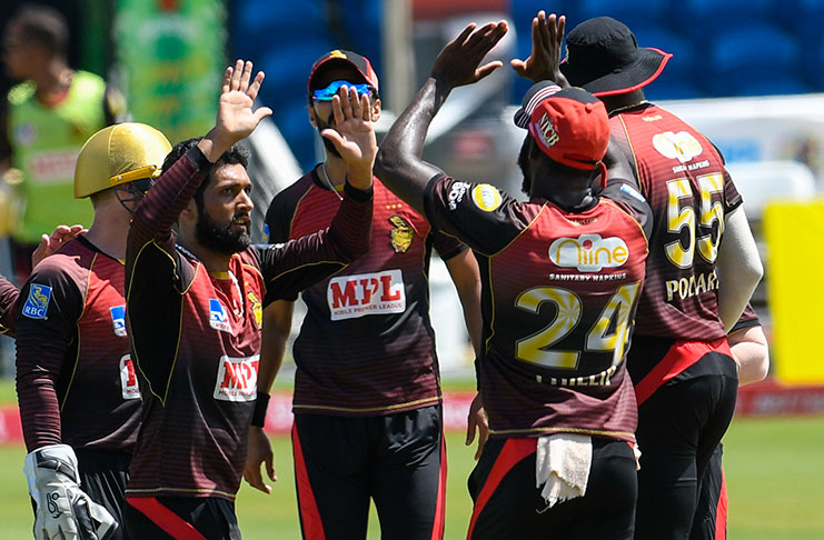 Sikandar Raza (L) of Trinbago Knight Riders celebrates the dismissal of Evin Lewis of St Kitts & Nevis Patriots during the Hero Caribbean Premier League match 29 between St Kitts & Nevis Patriots and Trinbago Knight Riders at Brian Lara Cricket Academy on September 6, 2020 in Tarouba, Trinidad And Tobago. (Photo by Randy Brooks - CPL T20/CPL T20 via Getty Images)