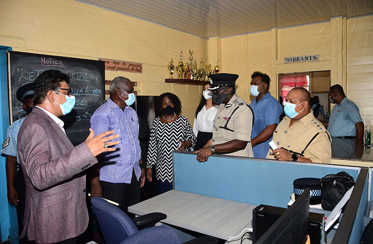 Attorney-General, Anil Nandlall; Home Affairs Minister, Roberson Benn; Commissioner of Police (ag), Nigel Hoppie and other officials inside the court superintendent office after the handing over of furnishings, equipment and other devices, as well as various law books (Adrian Narine photo)