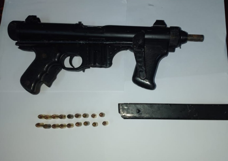 The gun and ammunition seized by police from the Surinamese