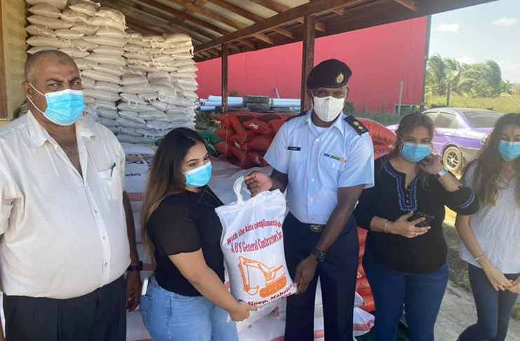 CDC’s Director-General, Lieutenant Colonel, Kester Craig, receiving COVID-19 relief supplies from businessman, Amjad Reasat
