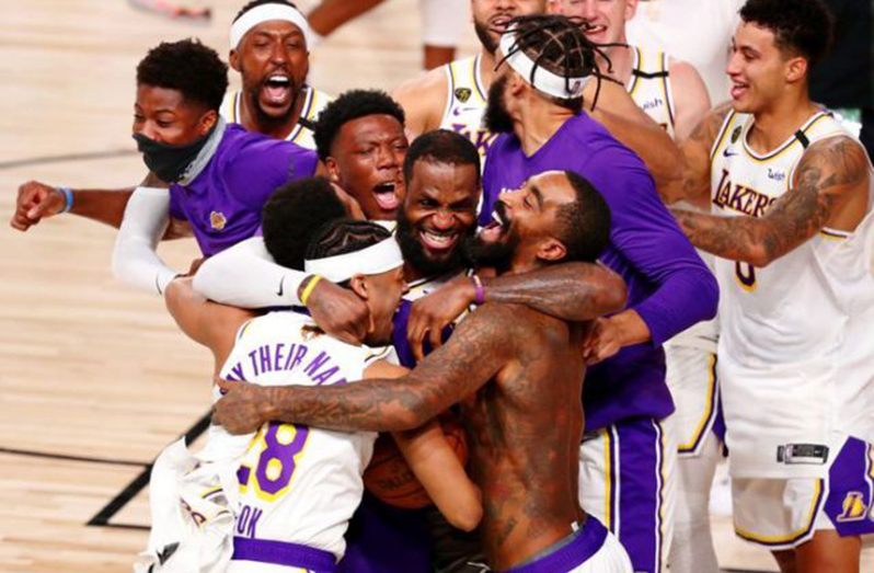 Los Angeles Lakers celebrate their 106-93 series win over Miami Heat after game six of the 2020 NBA Finals at AdventHealth Arena. (Mandatory Credit: Kim Klement-USA TODAY Sports)