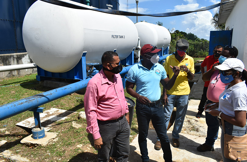 Minister of Housing and Water, Collin Croal (left) during a visit to the Bartica Water Treatment Plant on Saturday