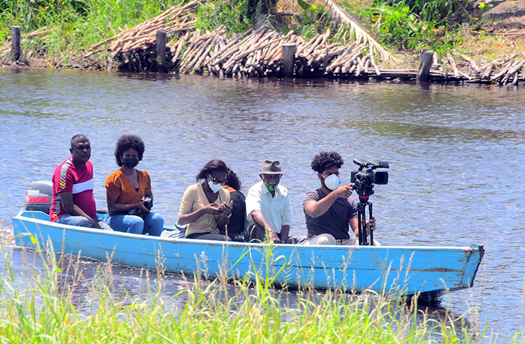 Beautiful Countryside: Media personnel accompanied by residents of Little Baiboo
using traditional river transport on the Mahaica Creek (Adrian Narine photo)