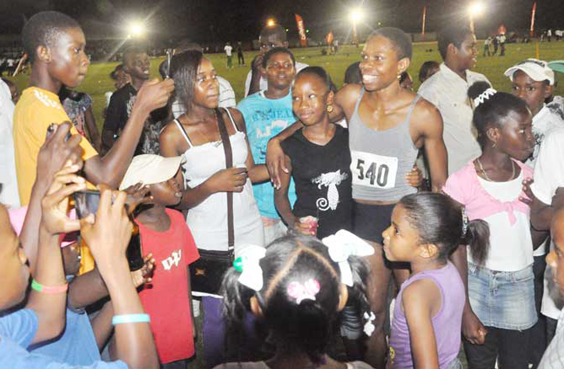 FLASHBACK! Guyana's Aliann Pompey is swarmed by fans after competing, for the first time in Linden in 2011, at the Jefford Classic.