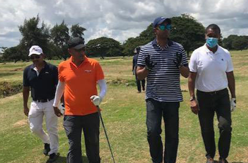 Minister of Sport Charles Ramson Jr. (center) and company during his visit to the Lusignan Golf club last Saturday