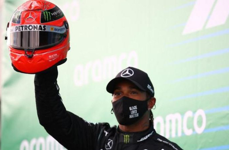 Michael Schumacher's son Mick presented Hamilton with one of his father's old helmets, from his last F1 season with Mercedes in 2012, to recognise the achievement.