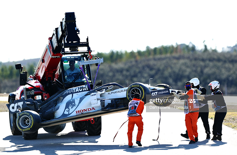 The car of Pierre Gasly of France and Scuderia AlphaTauri is removed from the circuit during practice ahead of the F1 Grand Prix of Portugal at Autodromo Internacional do Algarve on October 23, 2020 in Portimao, Portugal. (Photo by Dan Istitene - Formula 1/Formula 1 via Getty Images)