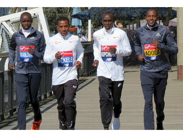 Kenya's Daniel Wanjiru and Eliud Kipchoge with Ethiopia's Kenenisa Bekele and Guye Adola pose for a photograph. London Marathon - Elite Men Press Conference - London, Britain - April 19, 2018. (Action Images via Reuters/Peter Cziborra)