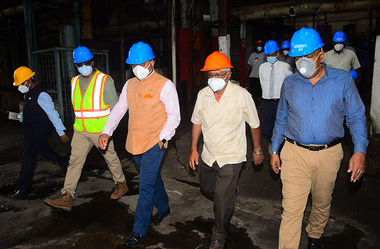 Agriculture Minister Zulfikar Mustapha (first from right) and High Commissioner of India to Guyana, Dr. K.J. Srinivasa (centre) being guided by manager of the Rose Hall Sugar Estate, Aaron Dukhia (second from right) and acting CEO of GuySuCo, Sasenarine Singh (Adrian Narine photo)