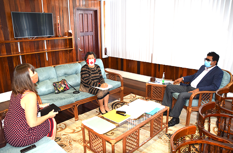 Attorney-General Anil Nandlall and Canada’s High Commissioner Lilian Chatterjee and her assistant during the meeting at the Ministry of Legal Affairs
