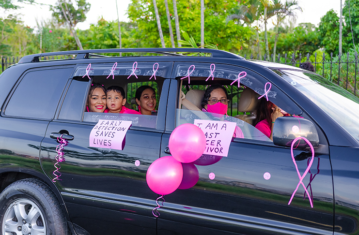 A family in solidarity with the victims of cancer at the cancer awareness motorcade