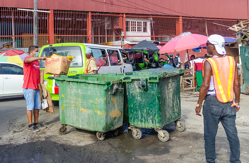 A citizen practising proper garbage disposal