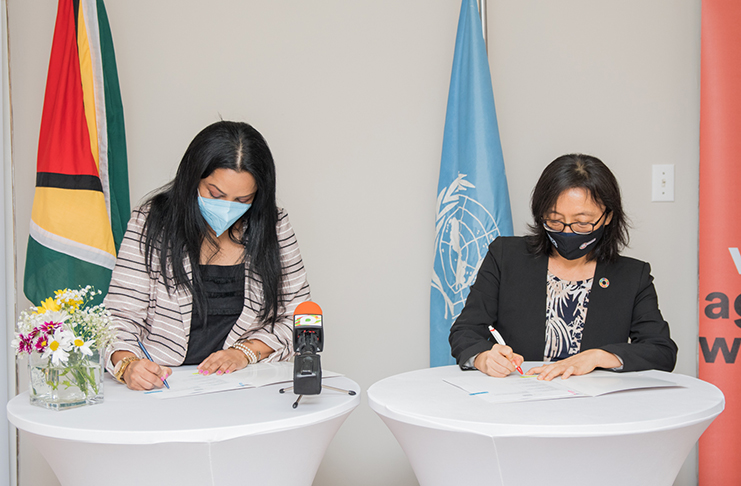 Minister of Human Services and Social Security, Dr. Vindhya Persaud and UN Resident Coordinator to Guyana, Mikiko Tanaka signing the ‘Spotlight Initiative’ Country Document on Saturday