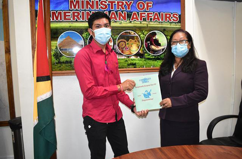Minister of Amerindian Affairs, Pauline Sukhai with one of the CSOs who successfully completed his training 