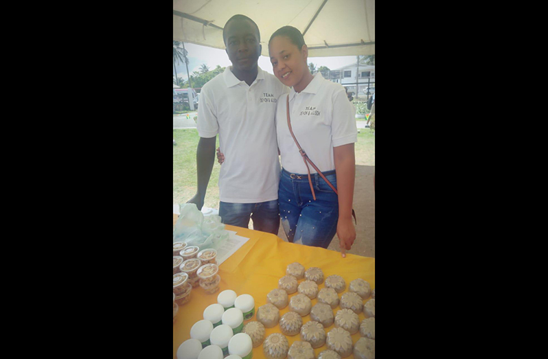 Devin and his wife Allison with some of the by-products of honey they have made such as soap and lip balm