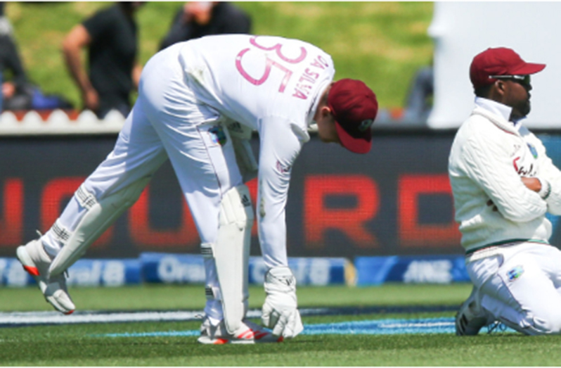 Darren Bravo (right) reacts in disappointment after dropping one of two catches at slip off Henry Nicholls in the second Test.