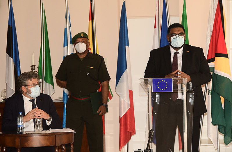 EU Ambassador to Guyana, Fernando Ponz Canto, looks on as President, Dr. Irfaan Ali addresses members of
the media at the diplomat’s Bel Air Springs, Georgetown residence on Thursday (Adrian Narine photo)