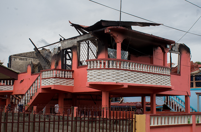 A Sunday morning fire destroyed this house at Eccles, East Bank Demerara,
devastating a family of four just days before Christmas Day (Photo: Vishani Ragobeer)