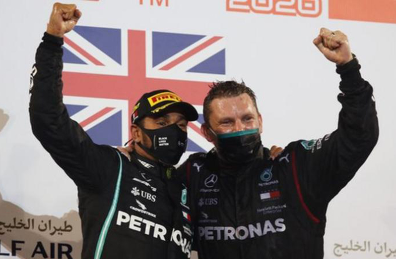 Lewis Hamilton (left) won the Bahrain Grand Prix on Sunday, his 11th race win of the season.