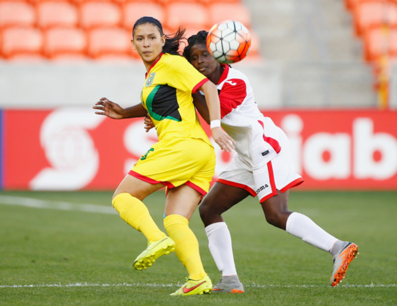 Khadidra Debesette #6 of Trinidad & Tobago battles for the ball against Guyana’s Mariam El-Masri during the 2016 CONCACAF Women's Olympic Qualifying at BBVA Compass Stadium on February 16, 2016 in Houston, Texas.