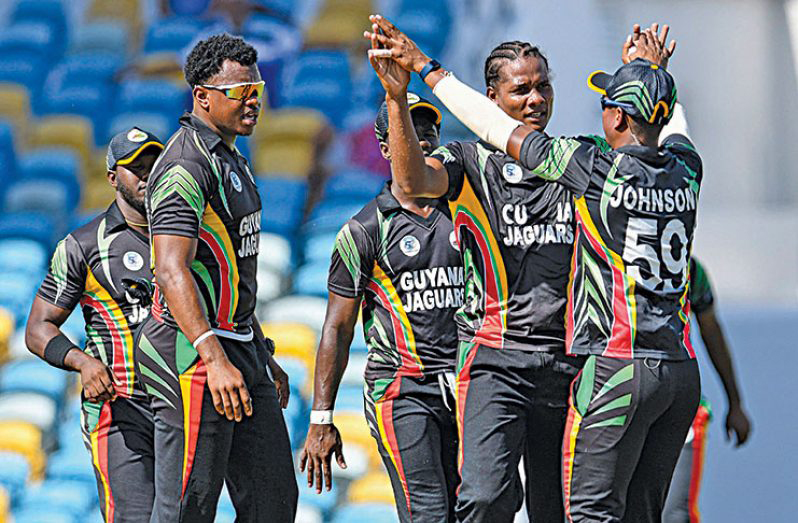 Flashback! Guyana Jaguars captain Leon Johnson congratulates Clinton Pestano during a regional game.