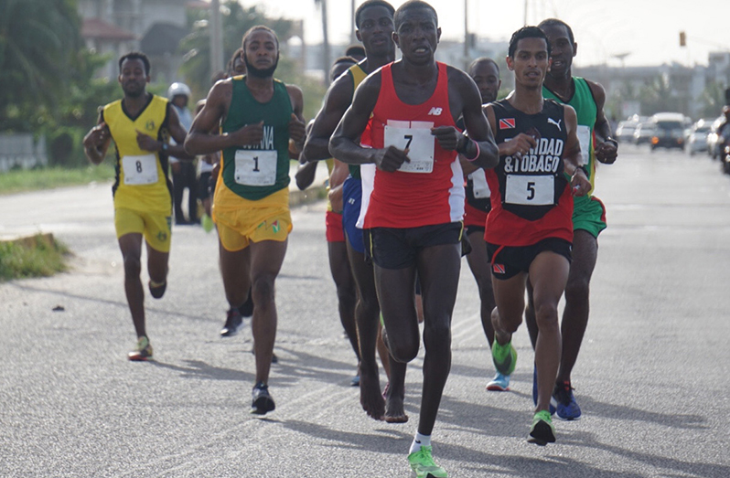 FLASHBACK! Kenyan Alex Ekesa led the pack on the Rupert Craig Highway during the 2019 South American 10K (Photo Credit: Emmerson Campbell)