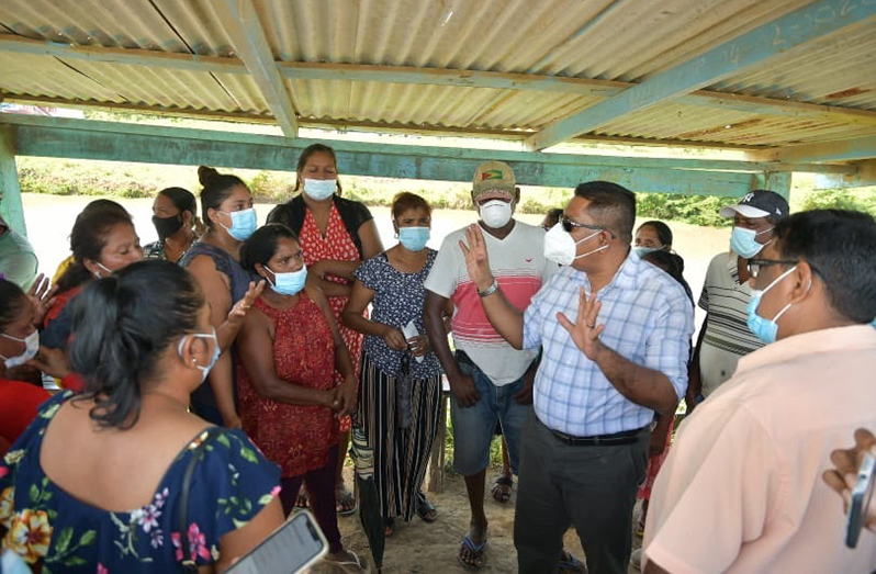 Agriculture Minister, Zulfikar Mustapha, discussing drainage and irrigation issues with farmers of Black Bush Polder