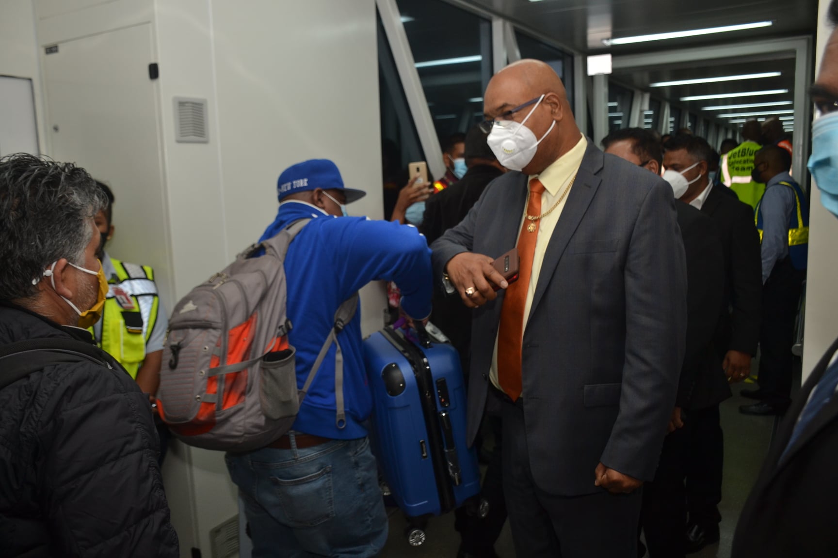 Minister of Public Works, Juan Edghill, greeting passengers that landed in Guyana on JetBlue’s Inaugural Flight