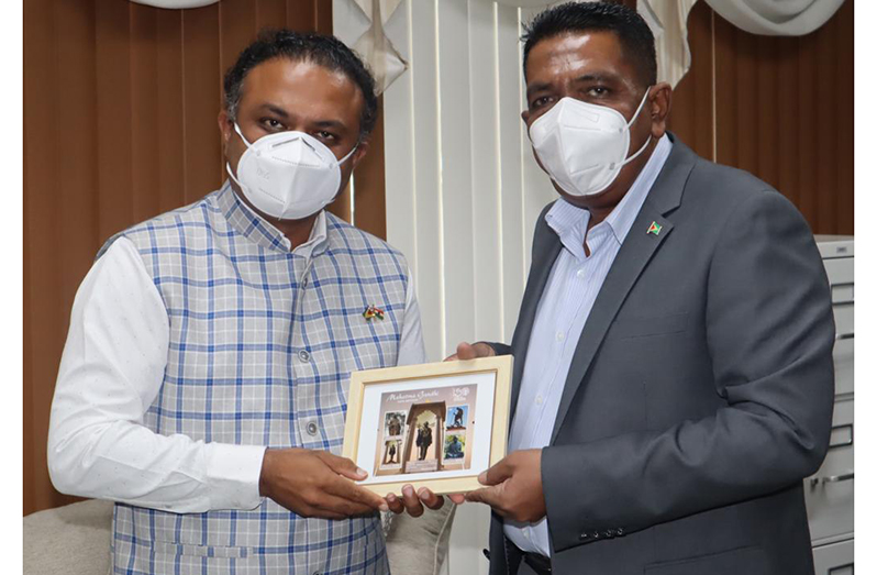 Agriculture Minister, Zulfikar Mustapha receives a token from the High Commissioner of India to Guyana, Dr. K.J. Srinivasa