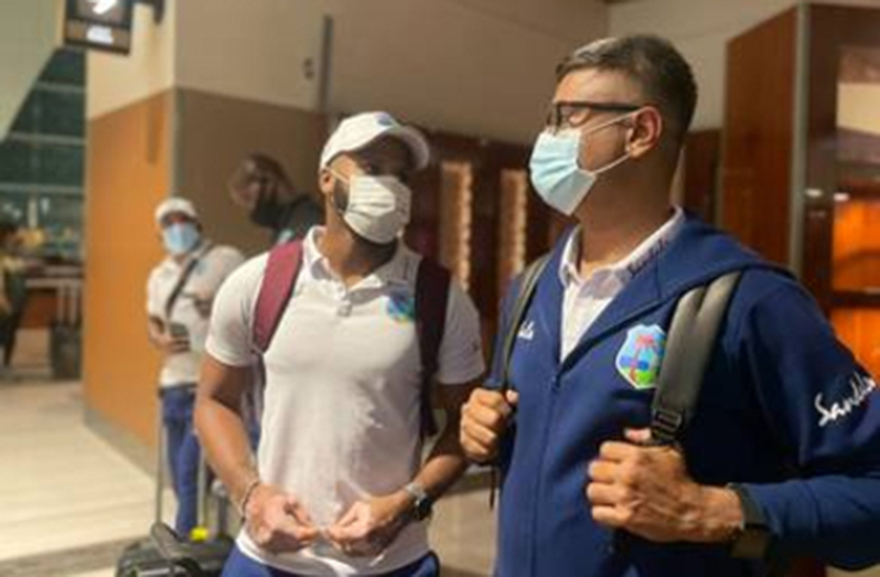 John Campbell (left) chats with assistant West Indies coach Monty Desai on arrival.