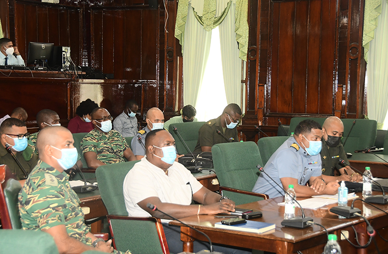GDF Accounting Officer, Commander Vernon Burnett (second right) along with other officers of the GDF before the PAC on Monday (Adrian Narine photo)