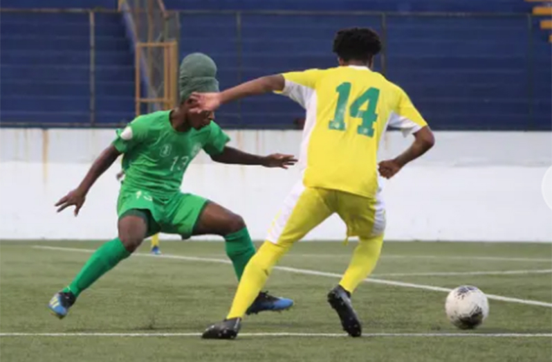 Guyana’s Hazlewood Hutson (14) tries to go on the attack against Montserrat’s Ahijah Daley in their 2020 CONCACAF qualifiers Group A match.