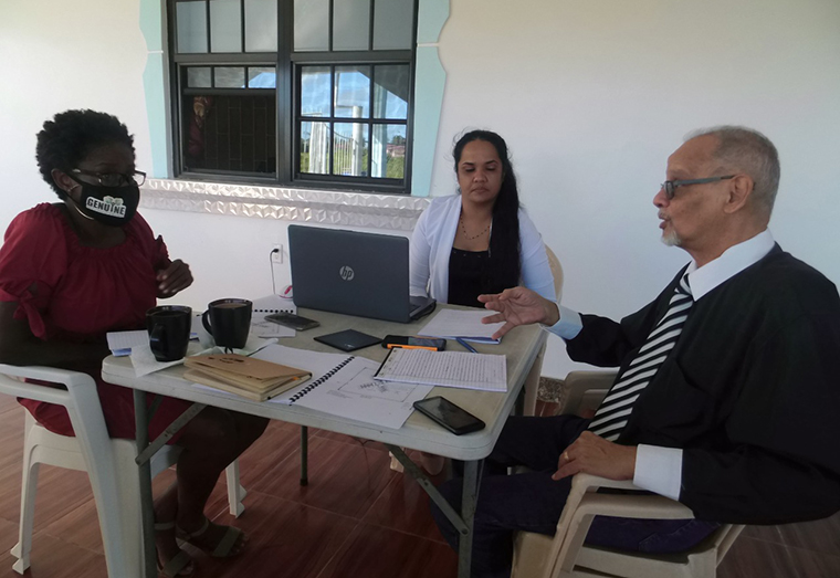 Reporter Jeune Bailey Van Keric (left) interviews Professor Daizal Samad and Ashwannie Harripersaud on the creation of their pandemic-ready classrooms