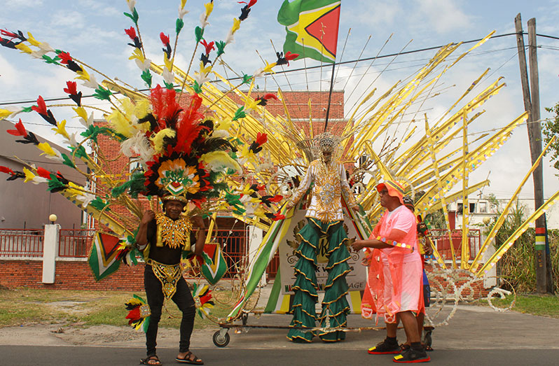 Maxi K Williams (centre) and Don Gomes (right) putting on a performance for passersby ((Vishani Ragobeer photo)