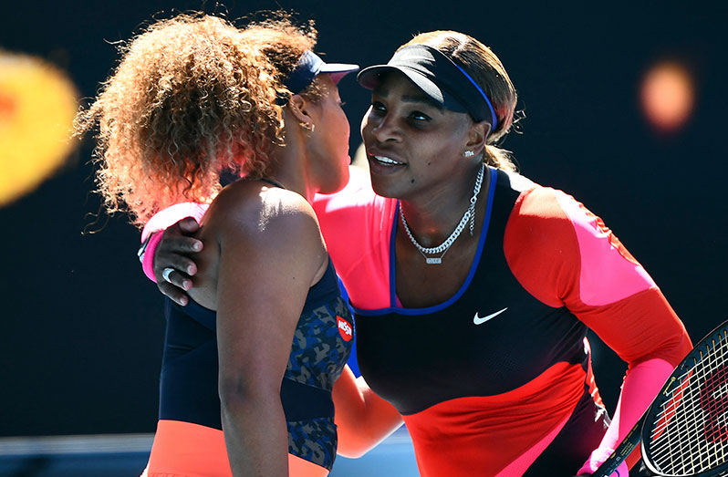 Japan's Naomi Osaka (L) gives a hug to Serena Williams of the U.S. after their women's singles semi-final match on day eleven of the Australian Open tennis tournament in Melbourne yesterday. (Photo by William WEST/AFP)