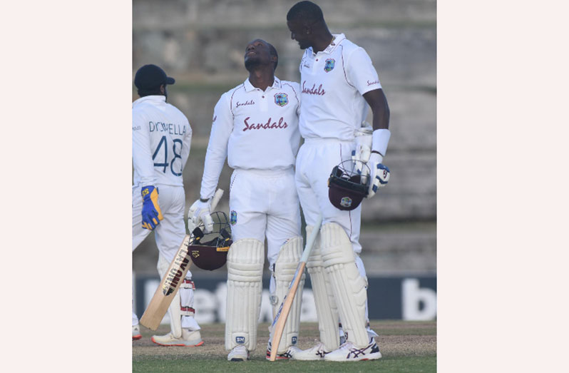 aAn overwhelmed Nkrumah Bonner is congratulated by Jason Holder after reaching his maiden Test hundred. (Photo courtesy CWI Media).