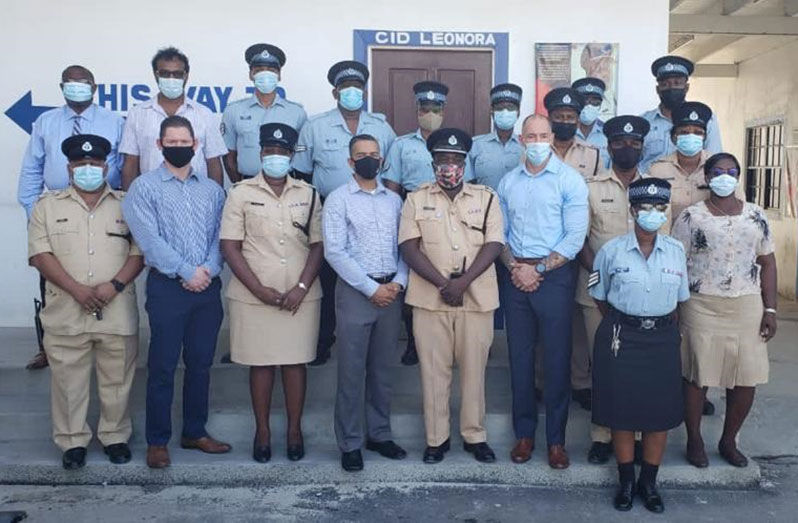 Regional Commander, Senior Superintendent, Errol Watts (fourth right in front row) flanked by HAP officials. Also in photograph are President of the Region Three Chamber of Commerce, Halim Khan (second left), and ranks who participated in the meeting